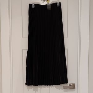 Black pleated skirt.